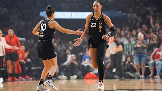 Las Vegas Aces forward Aja Wilson celebrates with guard Kelsey Plum.